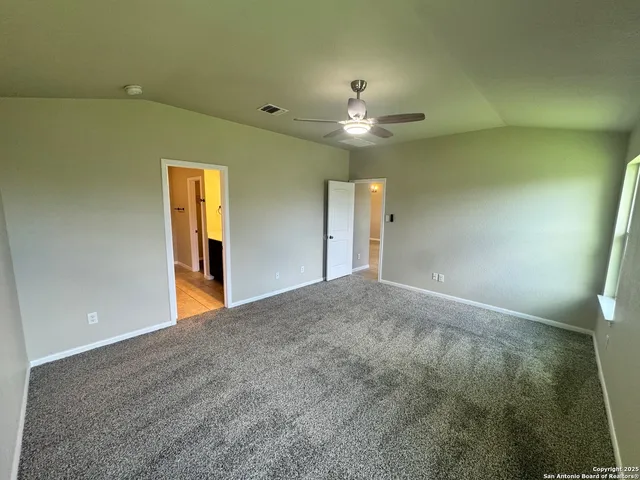 a bathroom with a glass door shower a sink and a mirror