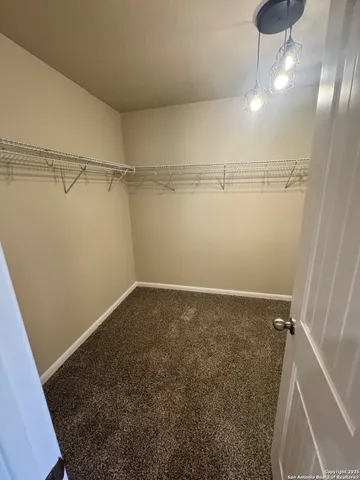 an empty room with a empty space and windows