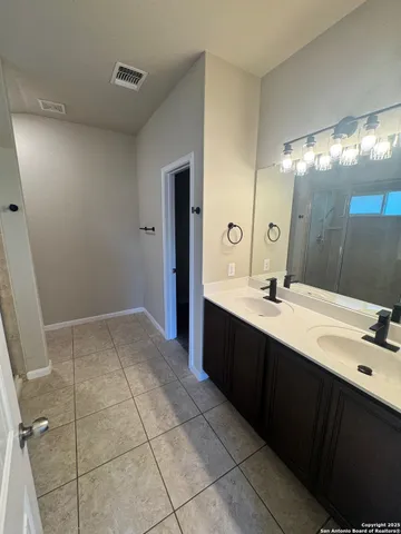 a view of house with backyard