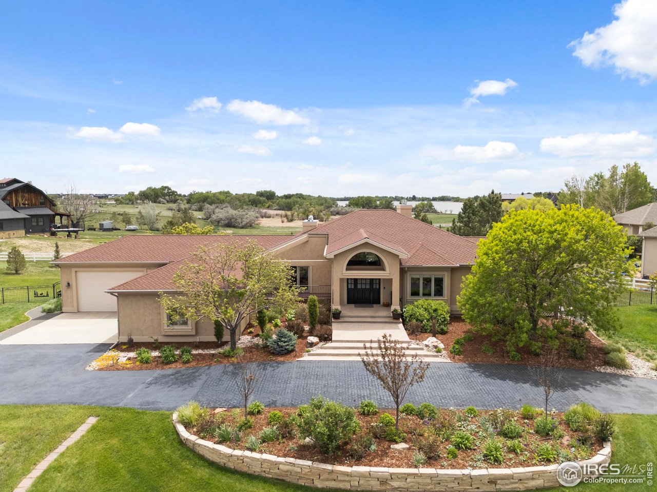 793 Richards Lake Road Fort Collins, CO 80524 - Photo 1 of 40 a front view of a house with garden