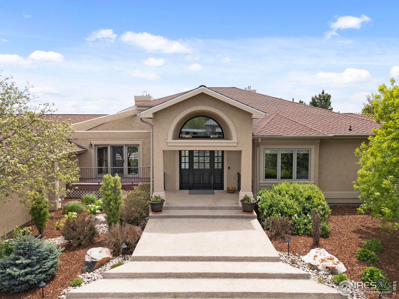 793 Richards Lake Road Fort Collins, CO 80524 - Photo 2 of 40 a front view of a house with a garden