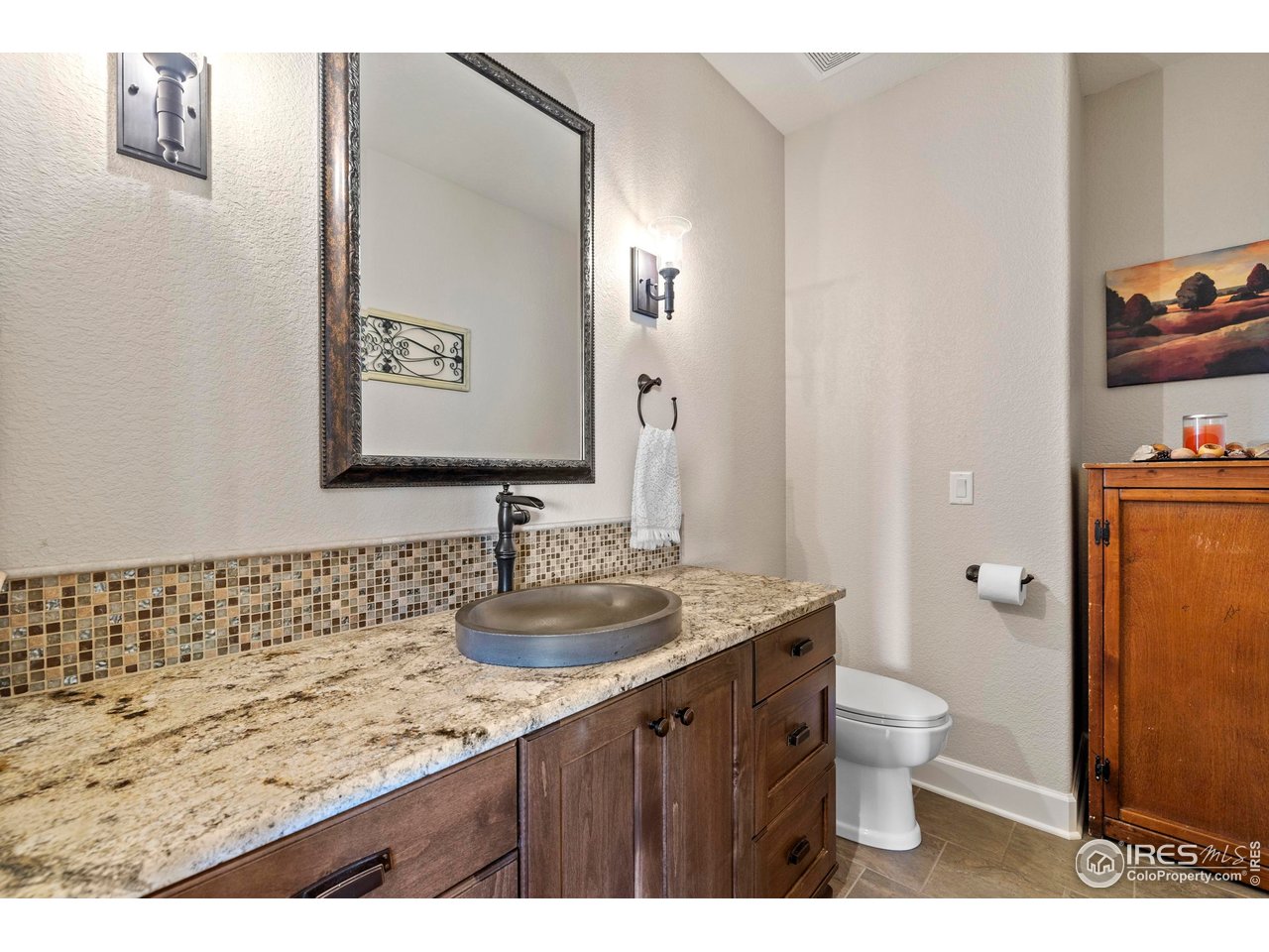 793 Richards Lake Road Fort Collins, CO 80524 - Photo 25 of 40 a bathroom with a granite countertop toilet sink and mirror