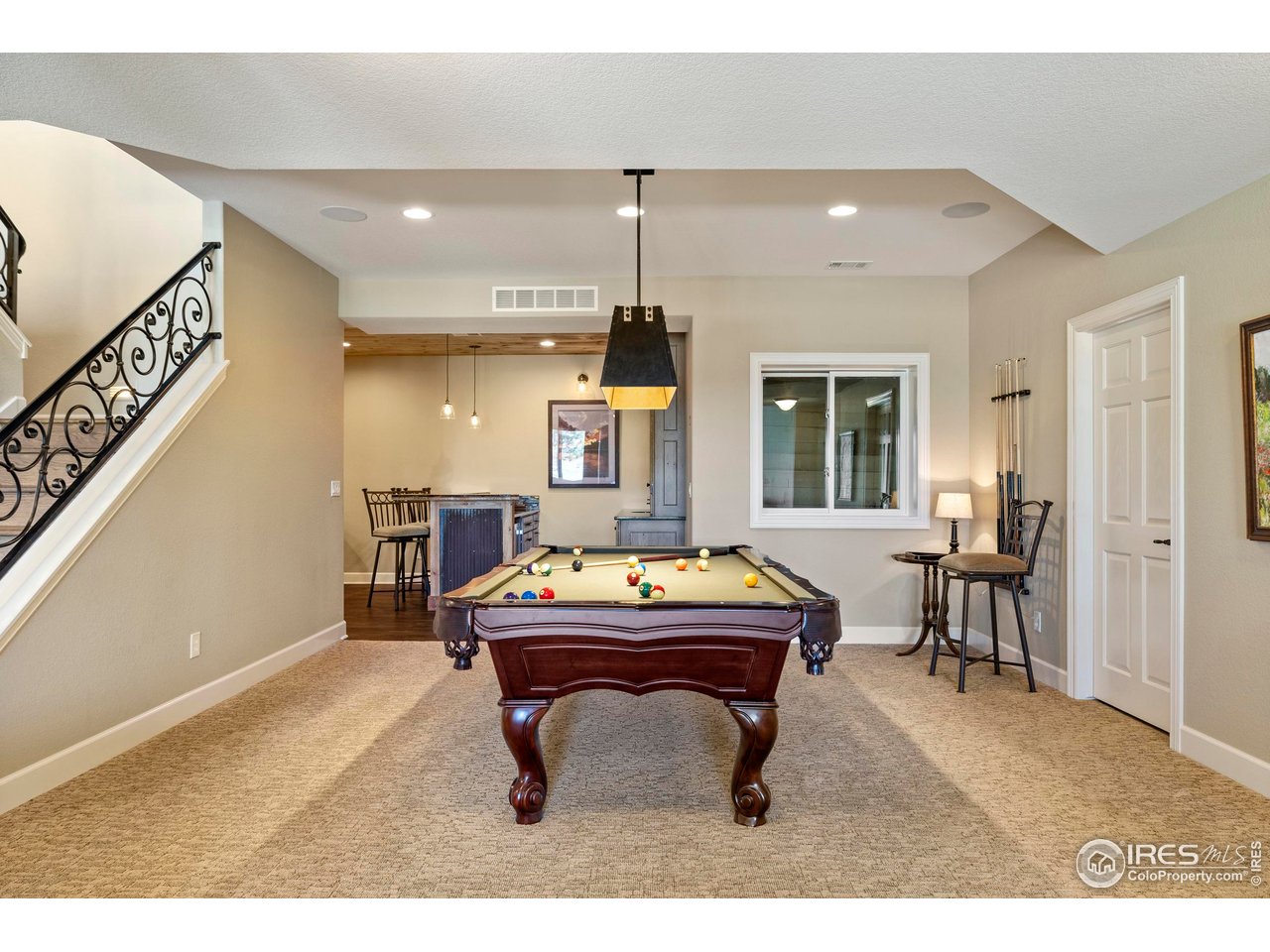 793 Richards Lake Road Fort Collins, CO 80524 - Photo 28 of 40 a living room with furniture a piano and a chandelier
