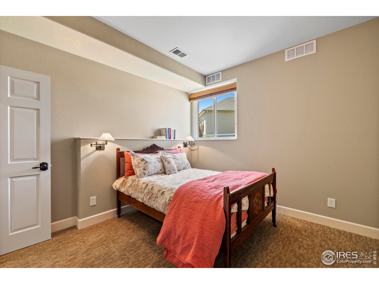 793 Richards Lake Road Fort Collins, CO 80524 - Photo 34 of 40 a bedroom with a bed and a cabinets