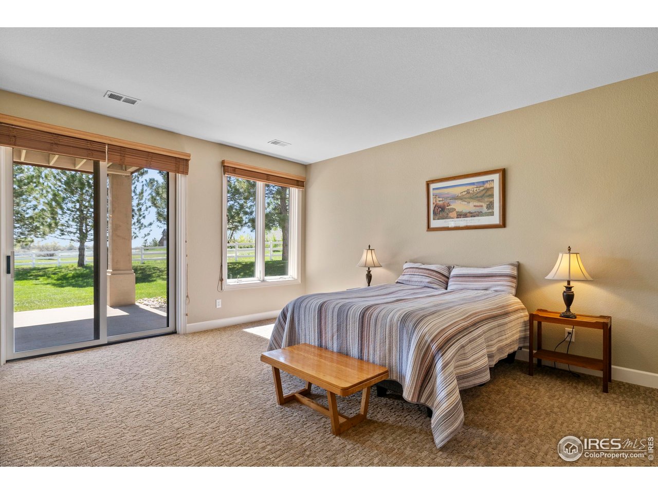 793 Richards Lake Road Fort Collins, CO 80524 - Photo 35 of 40 a spacious bedroom with a bed and a large window