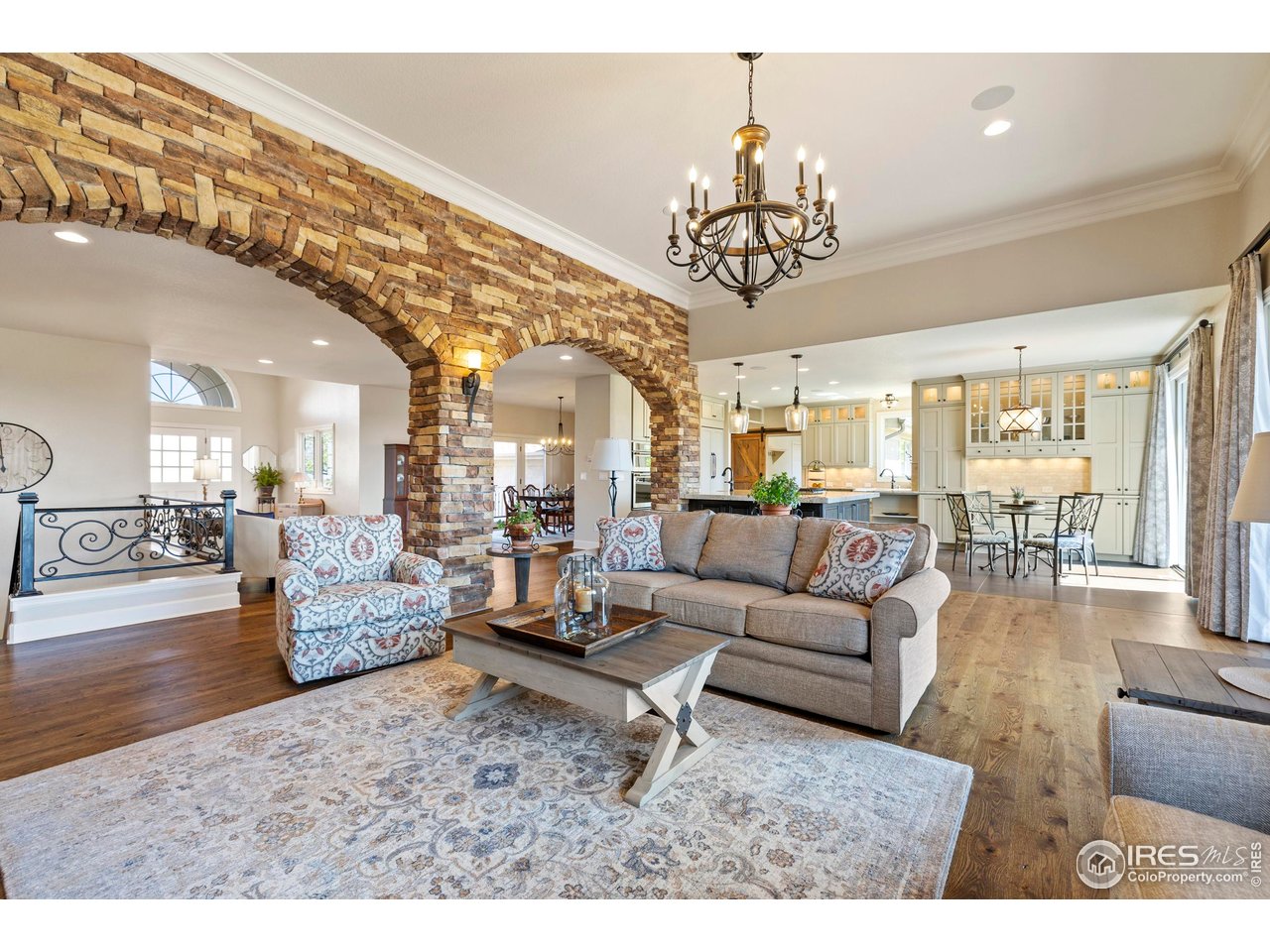 793 Richards Lake Road Fort Collins, CO 80524 - Photo 6 of 40 a living room with furniture and a chandelier