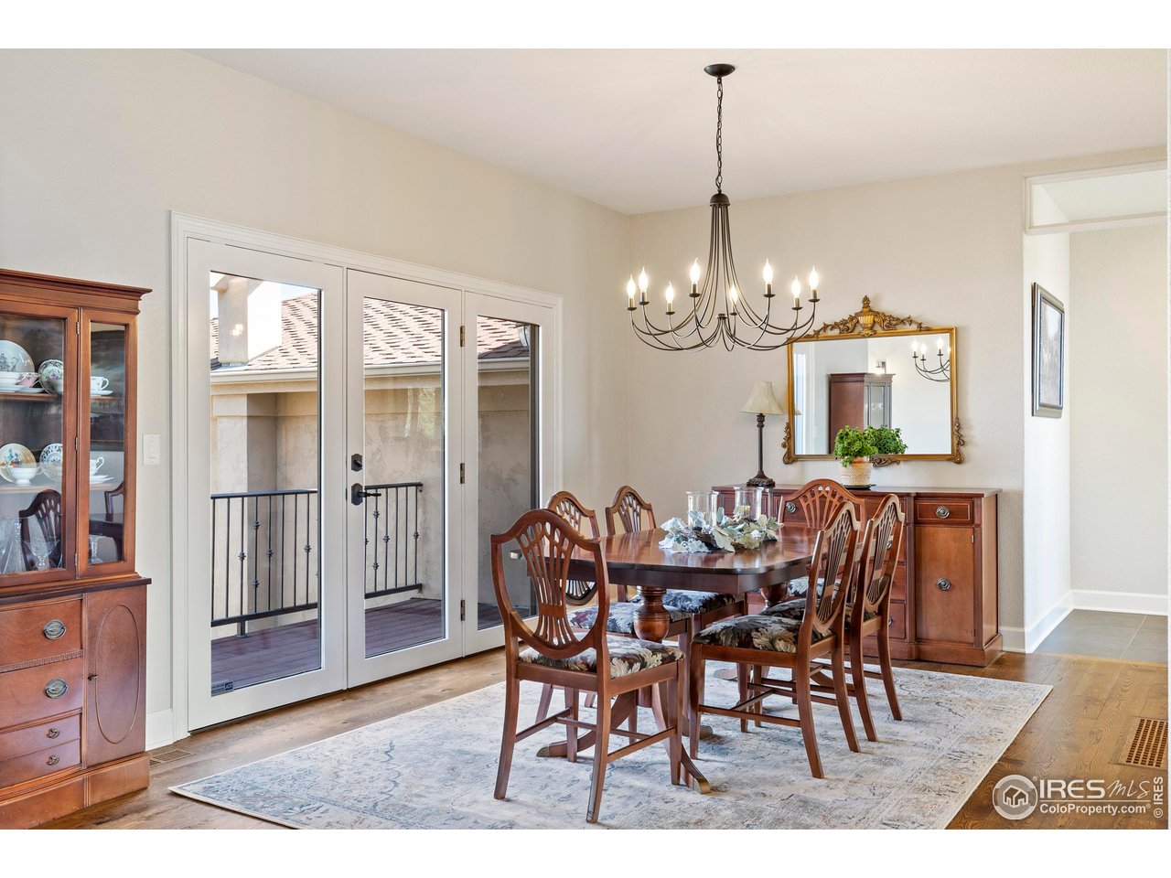 793 Richards Lake Road Fort Collins, CO 80524 - Photo 7 of 40 a view of a dining room with furniture window and wooden floor