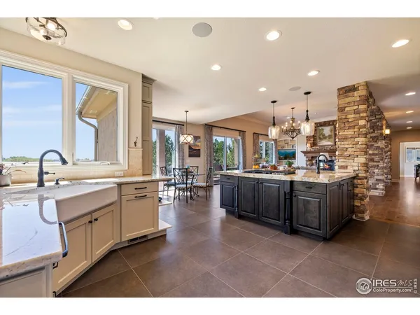 a large kitchen with a sink and cabinets