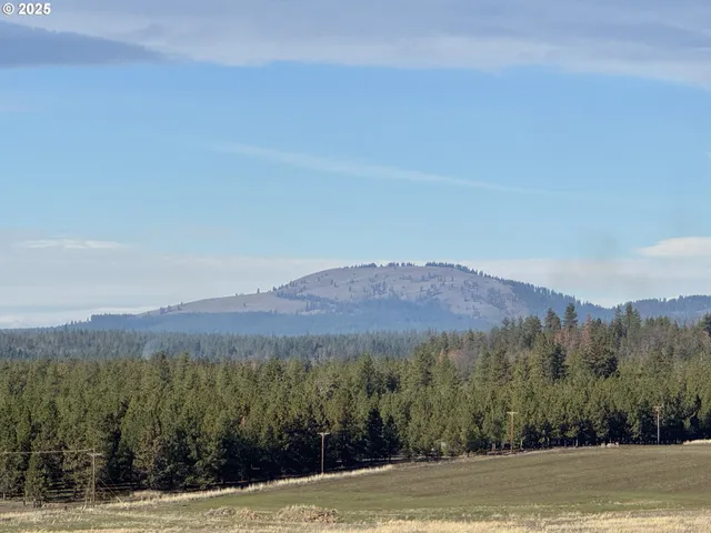 a view of a mountain with top of mountains