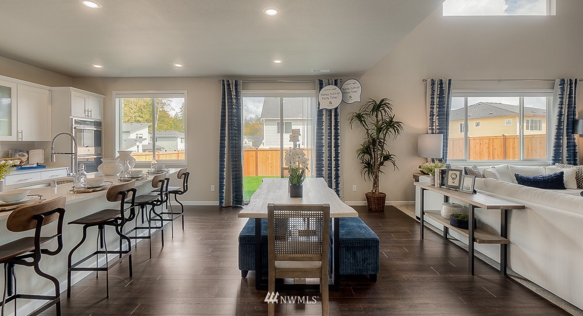4119 235th Place Southeast, Unit 37 Bothell, WA 98021 - Photo 7 of 23 a living room with furniture and wooden floor