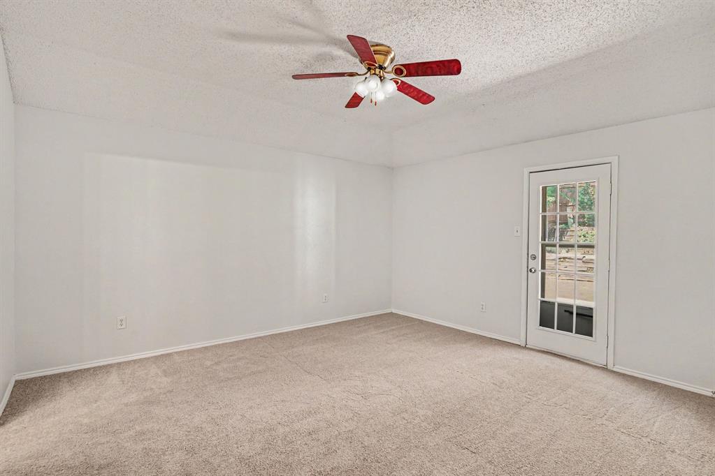 2541 Rivers Edge Drive Fort Worth, TX 76118 - Photo 14 of 31 an empty room with closet and fan