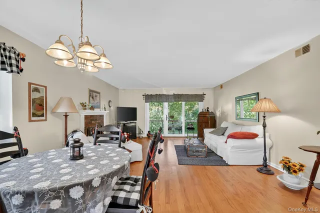 a view of a livingroom with furniture and a chandelier