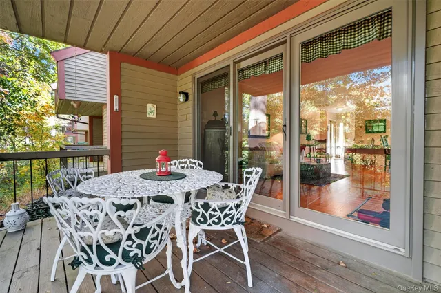a view of a patio with a table chairs and a table