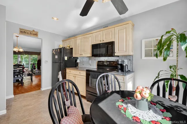 a bedroom with furniture a flat screen tv and a view of bedroom