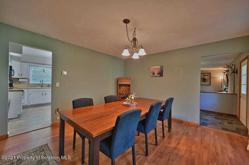 113 Marcy Road Tunkhannock, PA 18657 - Photo 15 of 82 a dining room with a table chairs and kitchen view