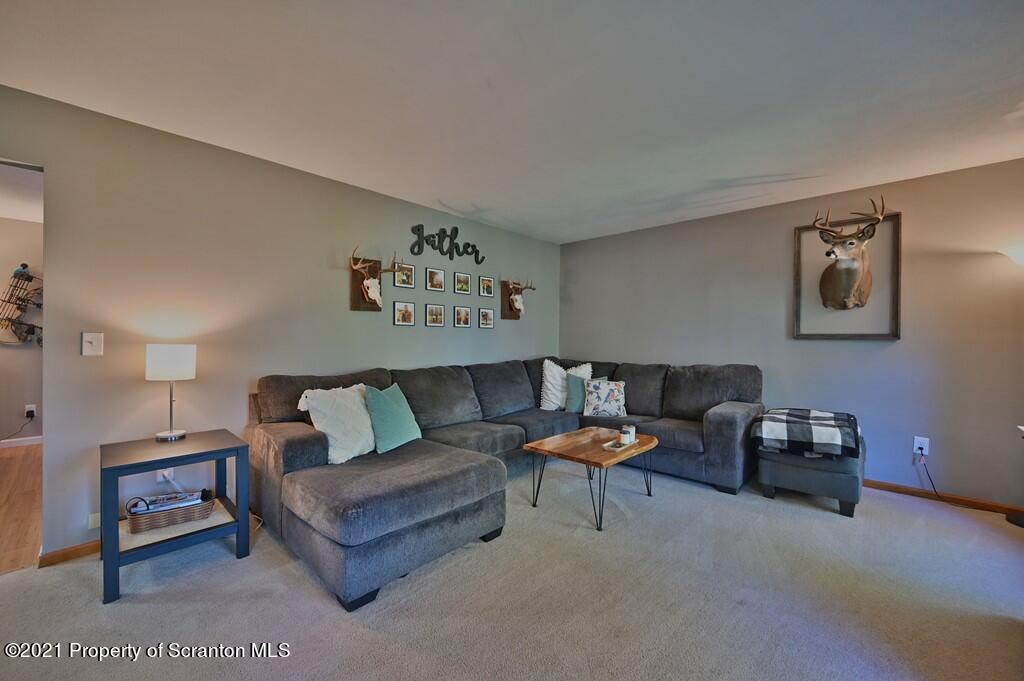 113 Marcy Road Tunkhannock, PA 18657 - Photo 22 of 82 a living room with furniture and paintings on the wall