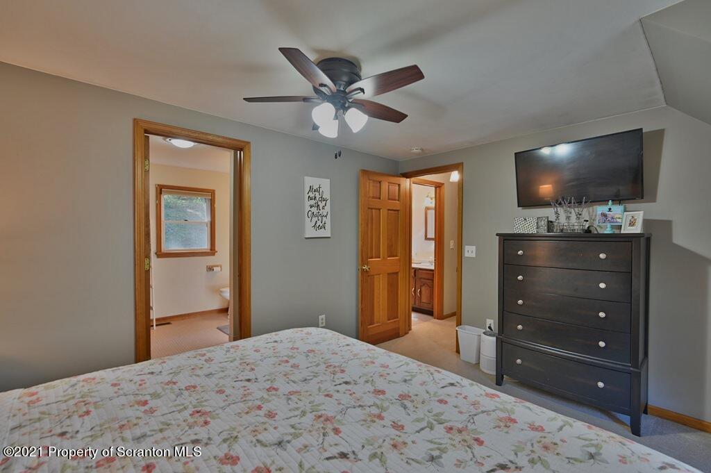 113 Marcy Road Tunkhannock, PA 18657 - Photo 39 of 82 a bedroom with a bed and a flat screen tv