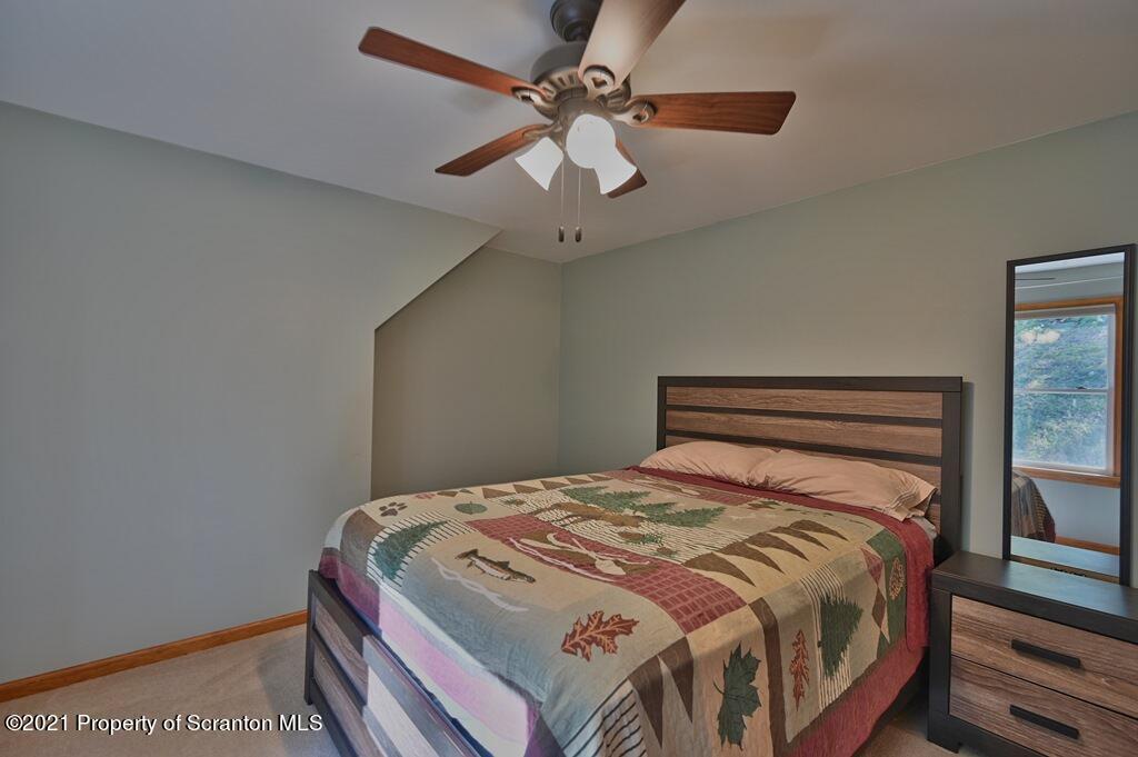 113 Marcy Road Tunkhannock, PA 18657 - Photo 44 of 82 a bedroom with a bed and a ceiling fan