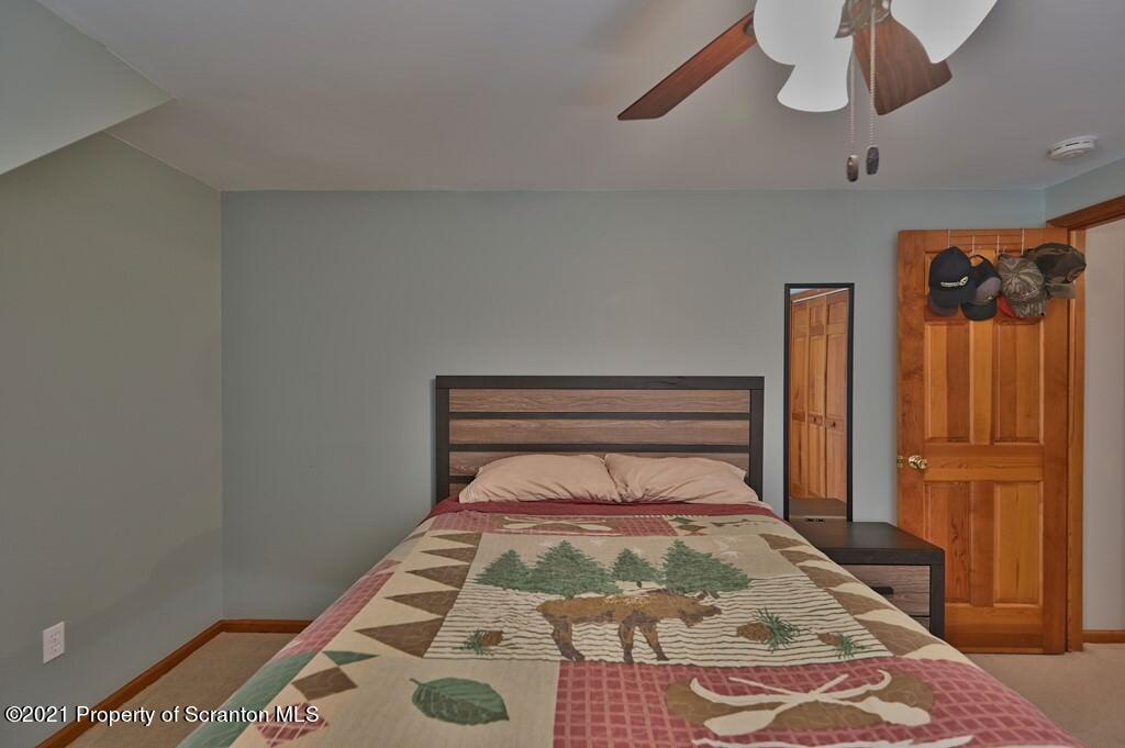 113 Marcy Road Tunkhannock, PA 18657 - Photo 45 of 82 a bedroom with a bed and wooden floor
