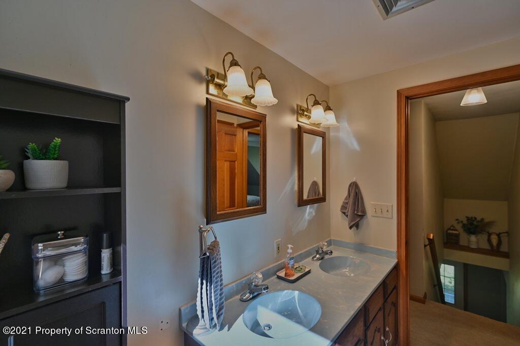 113 Marcy Road Tunkhannock, PA 18657 - Photo 55 of 82 a bathroom with a sink double vanity and a mirror