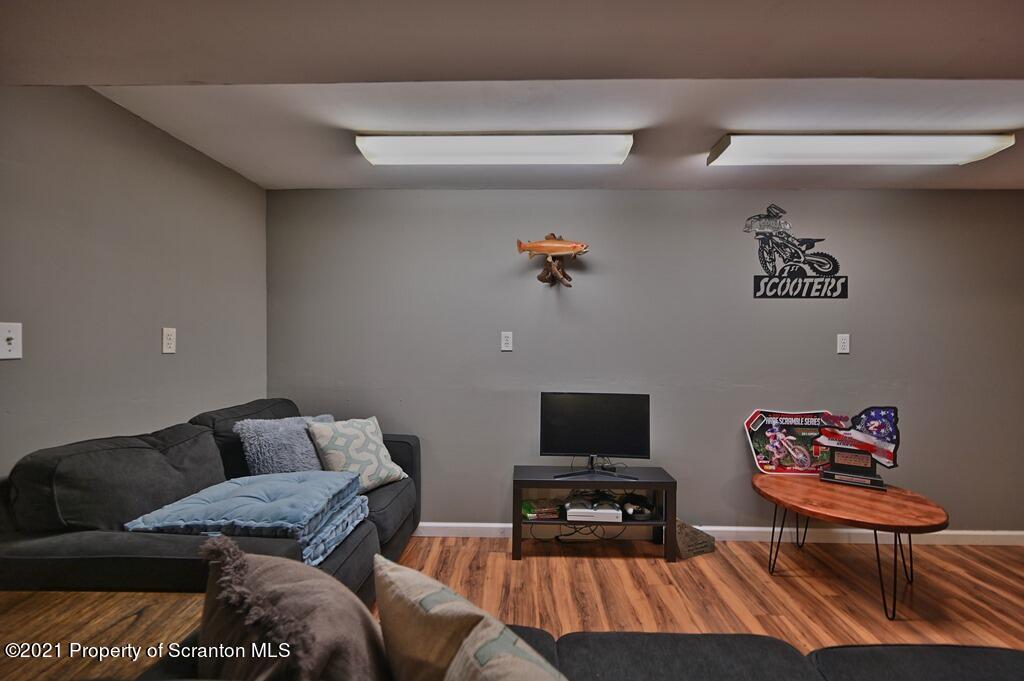 113 Marcy Road Tunkhannock, PA 18657 - Photo 56 of 82 a living room with furniture and a flat screen tv