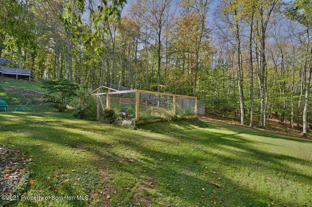 113 Marcy Road Tunkhannock, PA 18657 - Photo 65 of 82 a view of a white house in a big yard with large trees