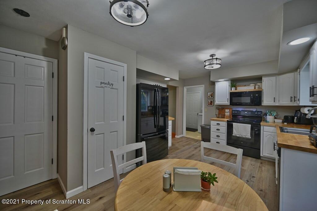 113 Marcy Road Tunkhannock, PA 18657 - Photo 8 of 82 a living room with stainless steel appliances furniture a rug and a view of kitchen
