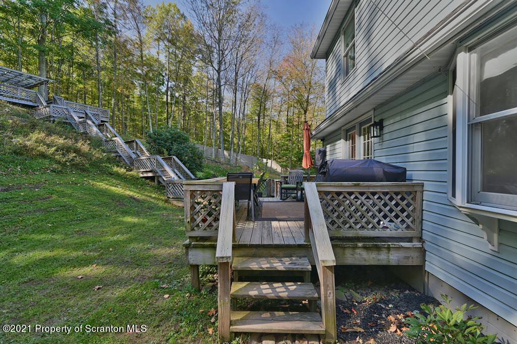 113 Marcy Road Tunkhannock, PA 18657 - Photo 81 of 82 a view of a chairs and table in the backyard