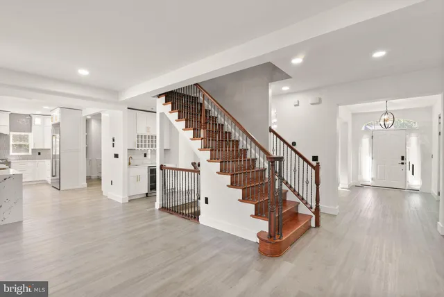 a large kitchen with a lot of counter space and stainless steel appliances