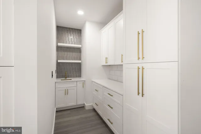 a bathroom with a shower and a glass door
