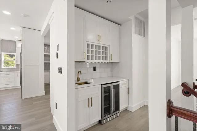a bathroom with a glass shower door and a sink