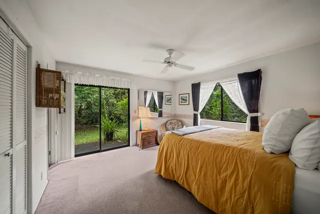 a bed room with a bed and a window