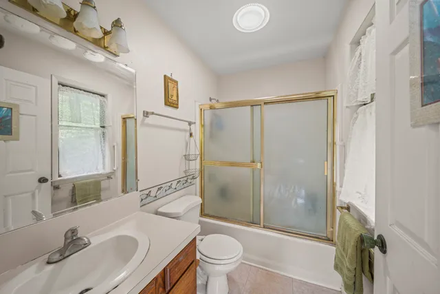 a view of a bedroom with workspace and a window