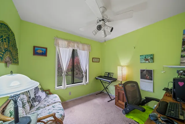 a bedroom with a bed and a mirror