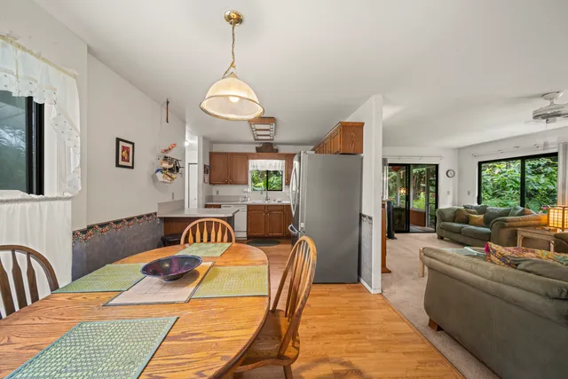 a living room with furniture and a book shelf