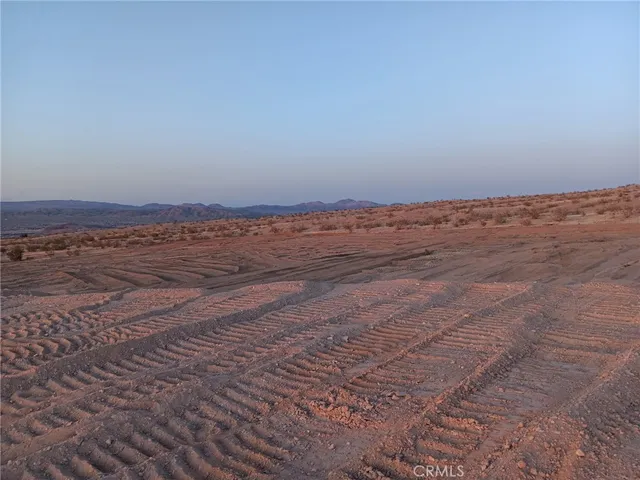a view of a road with a big yard