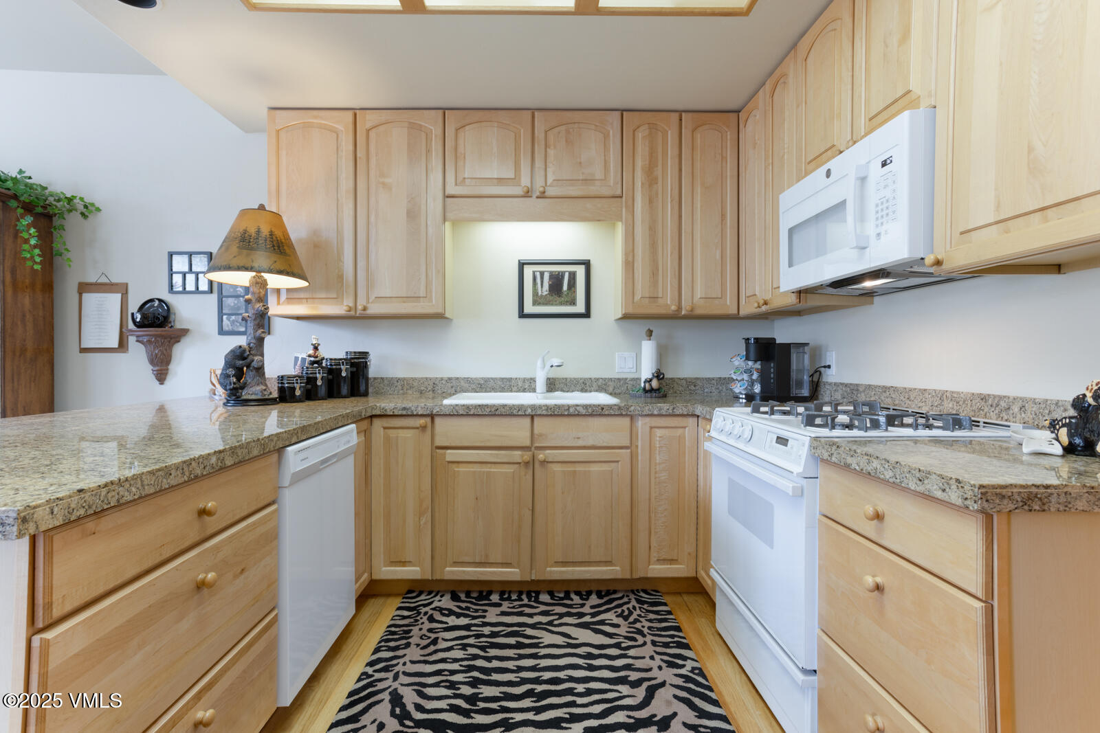 840 June Creek Road Edwards, CO 81632 - Photo 14 of 34 a kitchen with a sink stove top oven and cabinets