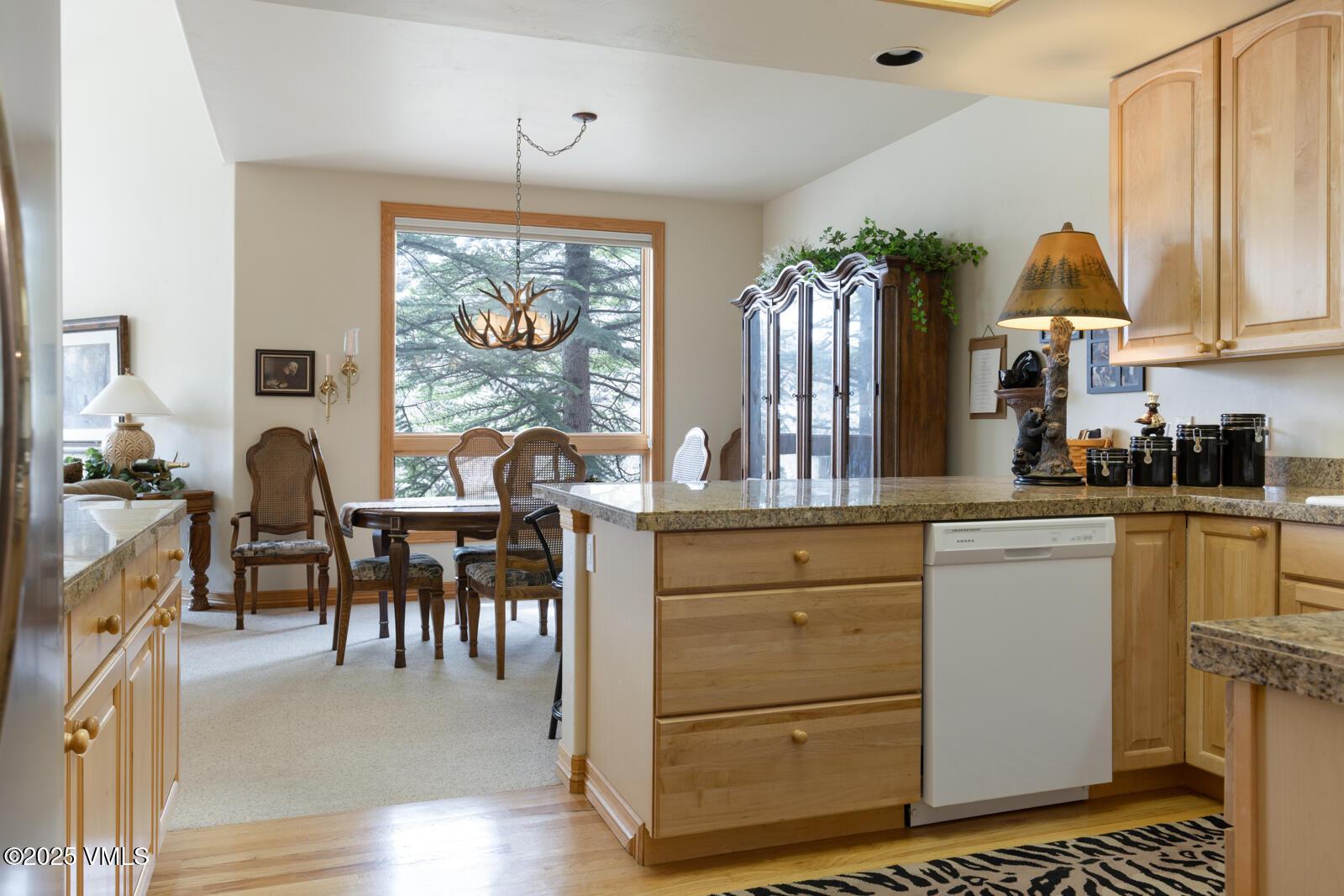 840 June Creek Road Edwards, CO 81632 - Photo 15 of 34 a kitchen with a refrigerator and a table