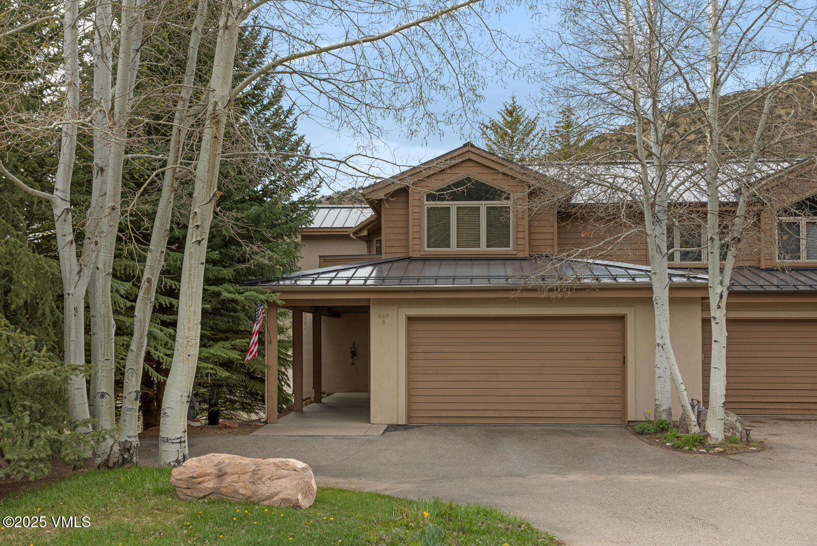 840 June Creek Road Edwards, CO 81632 - Photo 2 of 34 a front view of a house with a yard