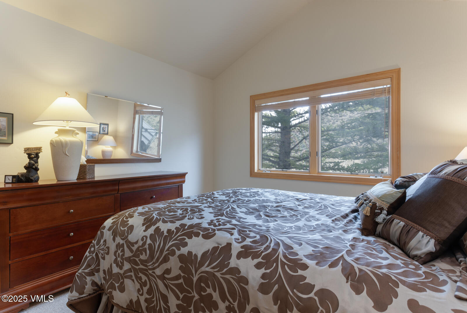 840 June Creek Road Edwards, CO 81632 - Photo 26 of 34 a bedroom with a bed and a window