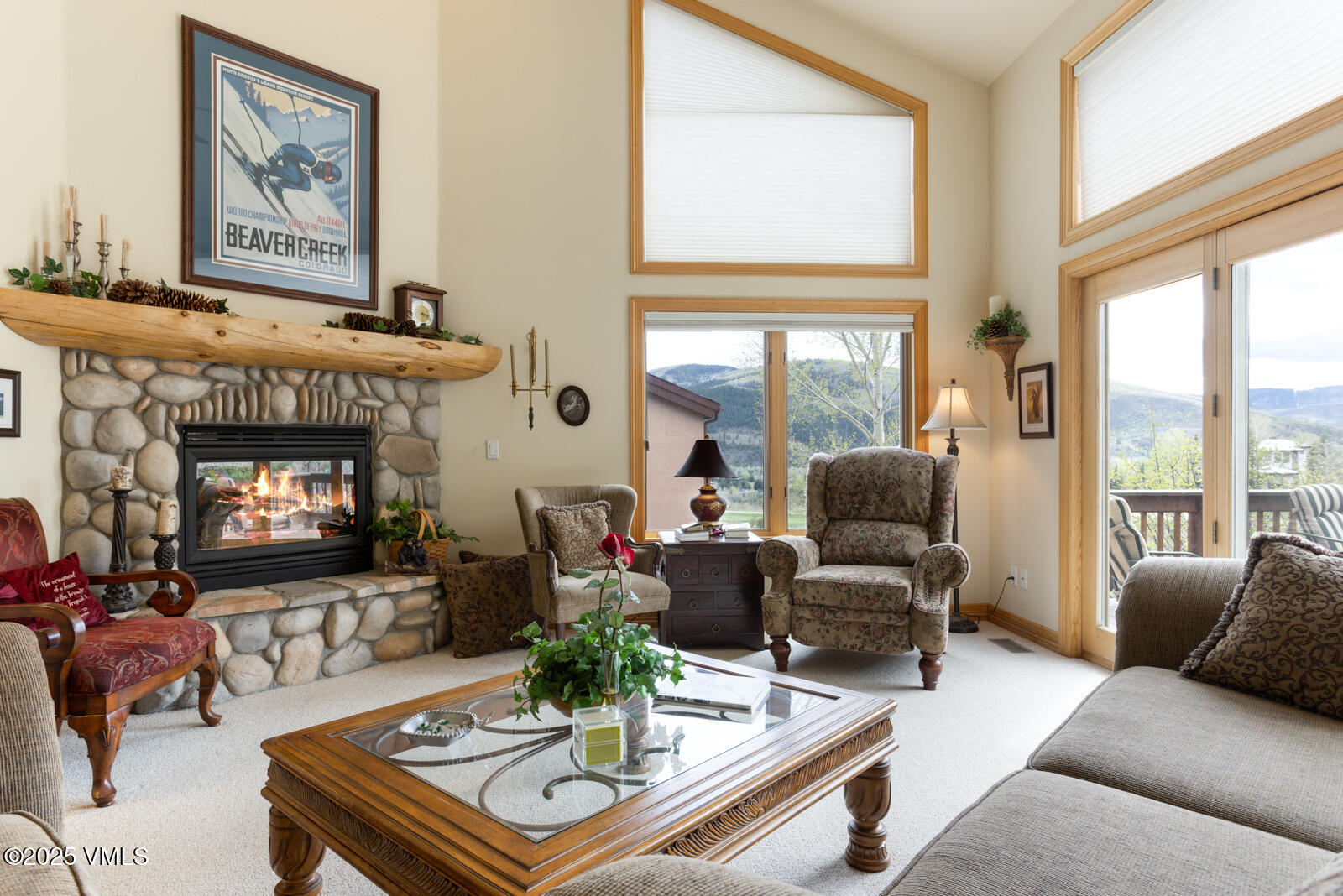 840 June Creek Road Edwards, CO 81632 - Photo 5 of 34 a living room with furniture a large window and a fireplace