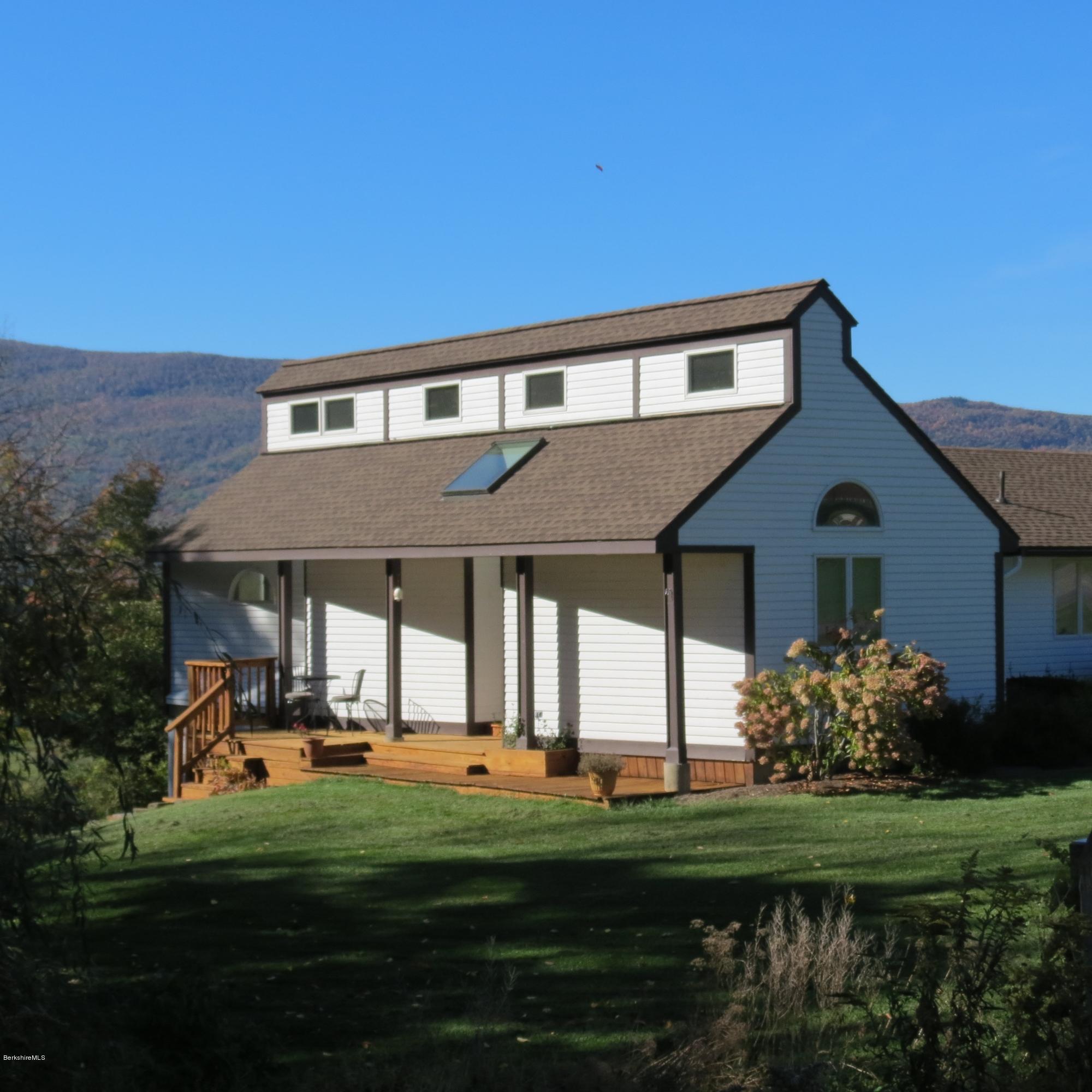 47 Walling Road Adams, MA 01220 - Photo 3 of 73 a front view of a house with a garden