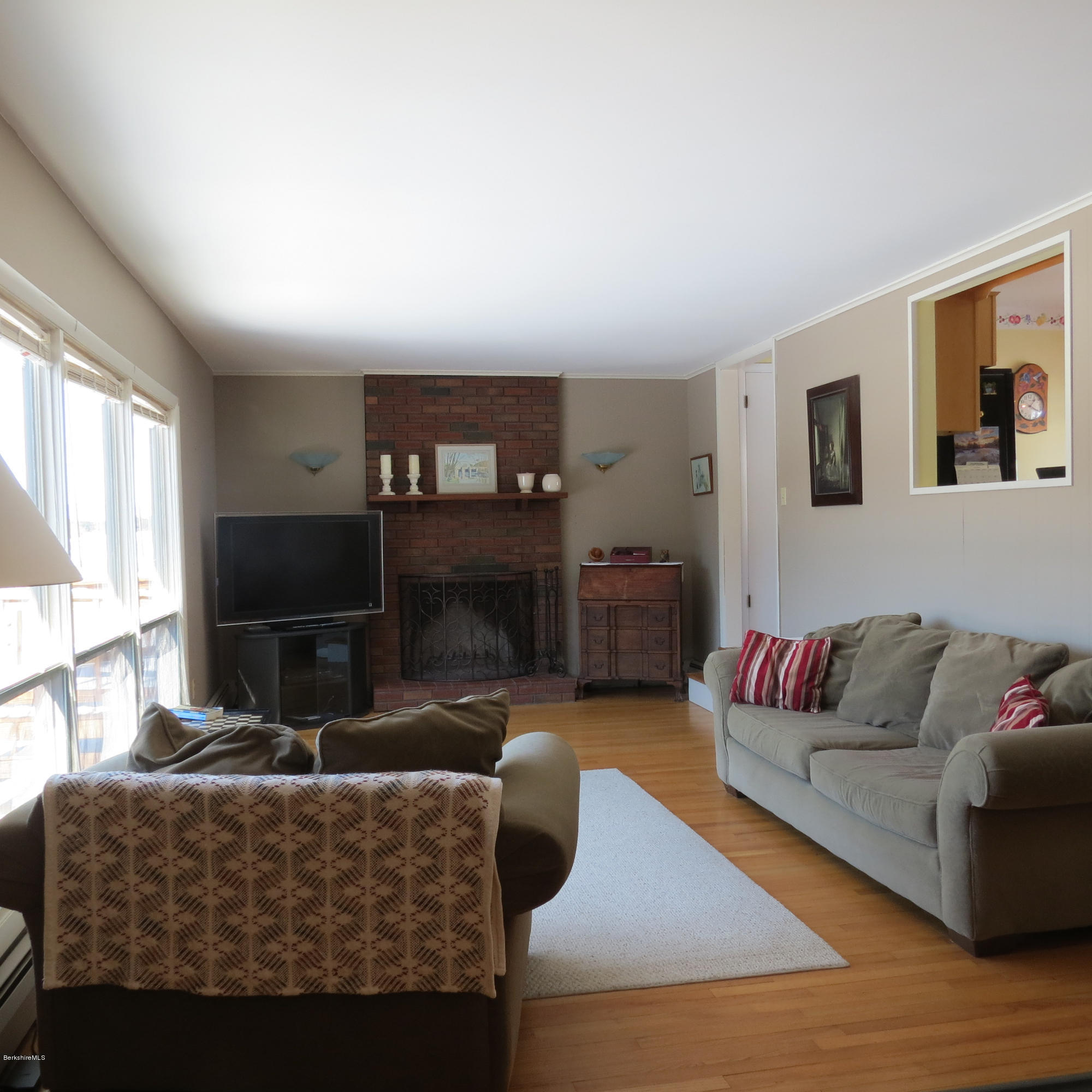47 Walling Road Adams, MA 01220 - Photo 22 of 73 a living room with furniture a flat screen tv and a fireplace