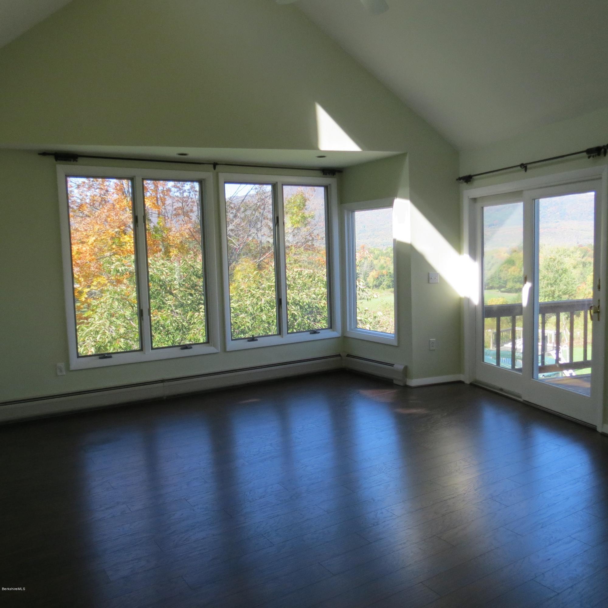 47 Walling Road Adams, MA 01220 - Photo 40 of 73 a view of an empty room with wooden floor and a window