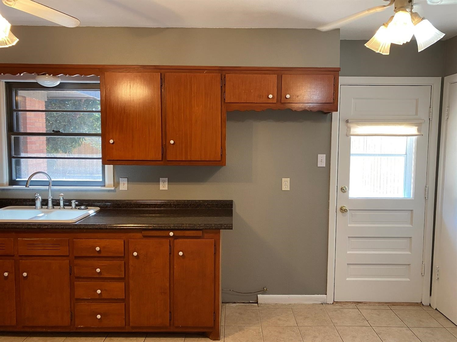 4819 44th Street Lubbock, TX 79414 - Photo 6 of 14 a kitchen with a sink and cabinets