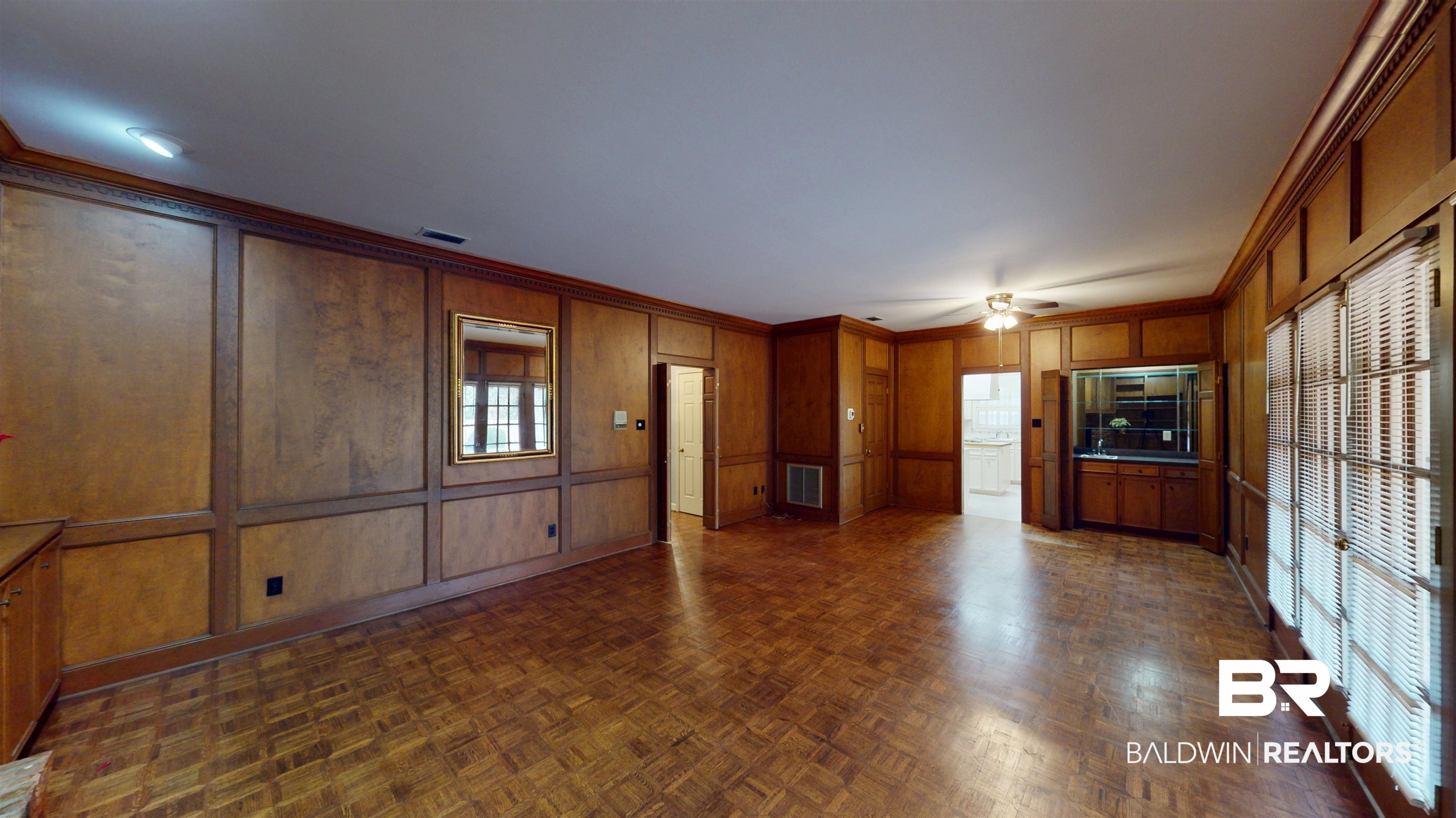 53 Warwick Road Mobile, AL 36608 - Photo 22 of 45 Den featuring a decorative wall, crown molding, and a ceiling fan