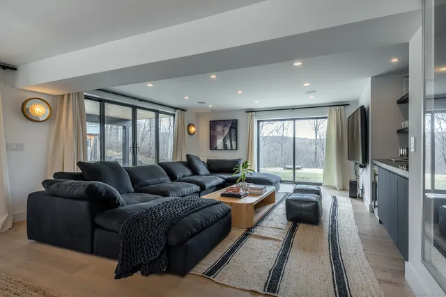 a living room with furniture and a window