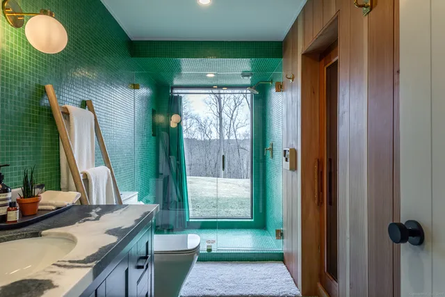 a view of a bathroom with tub and sink