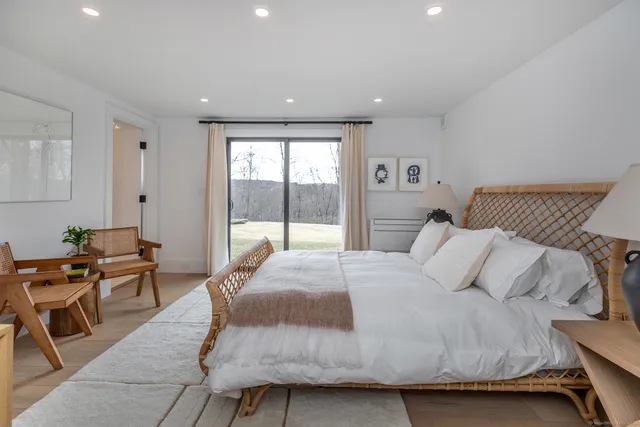 a bedroom with a bed and a desk