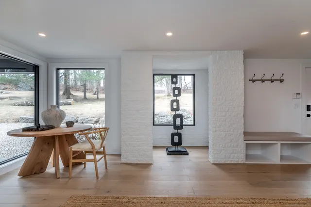a view of a room with gym equipment and windows